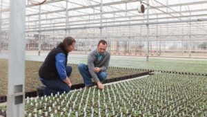 Jennifer Neujahr of Profile Products visits with South Central Growers