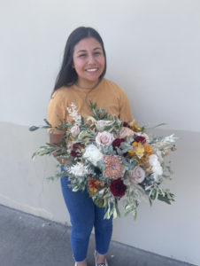 Maria Cervantes, Mosmiller Internship Award winner working at Poly Plant & Floral Shop