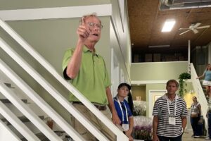 Dan Johnston, co-owner of Tri State Foliage, shares best practices with the tour group during Cultivate’24