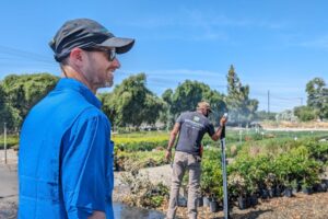 Bruno Pitton (left) observes irrigators measuring water pressure during the training at Generation Growers