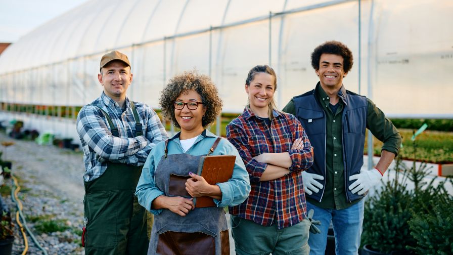 A greenhouse and gardener outdoor business team working together self-sufficiently