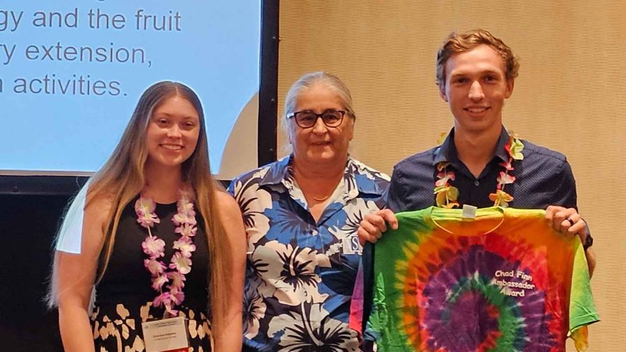 Patrick Veazie accepted the Chad Finn Ambassador Award on behalf of Dr. Perkins-Veazie at the 2024 ASHS conference. From left to right: Brianna Haynes, Gina Fernandez and Patrick Veazie.