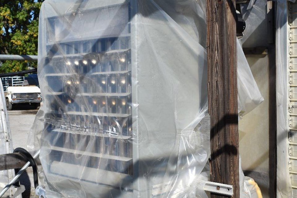 Example of covering a unit heater during the summer months with poly when the greenhouse glazing material was removed.